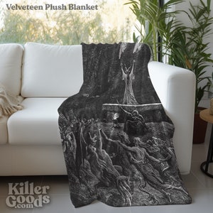 May include: A black and white plush blanket featuring a vintage illustration of a scene from Dante's Inferno. The illustration depicts a group of figures in a dark, shadowy setting.