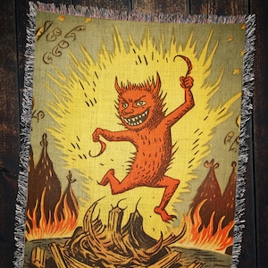 May include: A red devil with a pointed tail and horns is jumping out of a fiery pit. The devil is surrounded by flames and smoke. The background is a yellow and orange color.