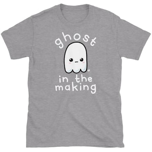 May include: A heather grey t-shirt with a white ghost illustration and the text "ghost in the making".
