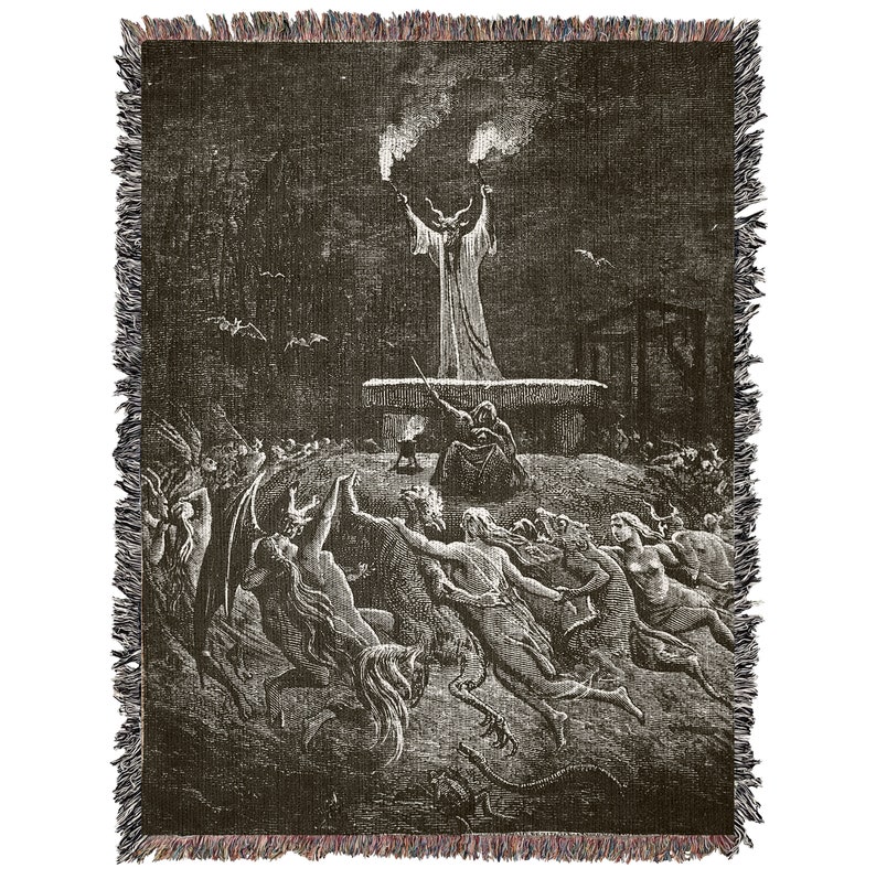 May include: Black and white woven tapestry featuring a scene of a devilish figure with horns and a long robe, standing on a platform and raising their arms with torches.  The devilish figure is surrounded by a crowd of people running towards them.
