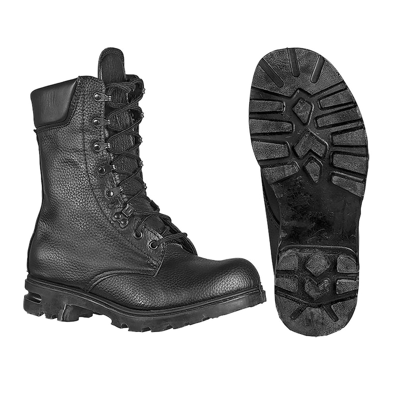 May include: Black leather combat boots with laces and a thick rubber sole. The boots are shown from the side and the sole is shown from the bottom.