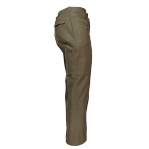 May include: A pair of olive green linen pants with a side pocket.