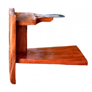 May include: A wooden wall-mounted shelf with a small metal shelf on top. The shelf is stained a reddish-brown color.