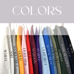 May include: A row of sweatshirts in various colors, including white, ash grey, gold, light pink, red, maroon, purple, light blue, royal blue, indigo blue, military green, forest green, dark heather, navy, and black.