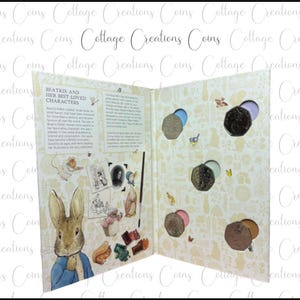 May include: Open book featuring Beatrix Potter illustrations and coin display. The left page has a portrait of Peter Rabbit and text. The right page has coin cutouts with coins and colorful inserts. The background is cream-colored with small illustrations.