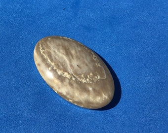 Sacramento River stone Cabochon tan and cream color approximately 43 mm x 26 mm Oregon made