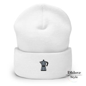 May include: A white beanie with a black embroidered coffee maker design. The beanie is made of a soft, knitted material and has a folded cuff. The design is located on the front of the cuff. The text "Dhlove Style" is on the lower right.