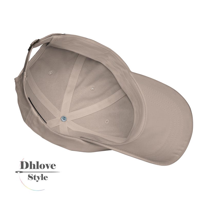 May include: A tan baseball cap with a curved brim, visible from the inside. The cap features a fabric strap for adjustment and a button at the crown. The brand name "Dhlove Style" is printed on the bottom left.