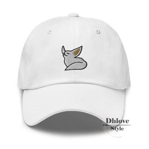 May include: White baseball cap with a curved peak. The cap has an embroidered design of a stylized fox with a black outline, grey body, and tan ears. The text "Dhlove Style" is printed on the side.