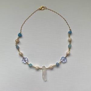 Gold crystal charm necklace