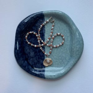 Beaded shell necklace with pearl