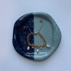 Gold bracelet with pearl charms
