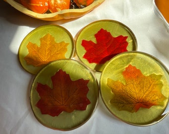 Autumn Resin Coasters (4) with Colorful Leaves Against a Moss Green Background Edged in Gold Leafing