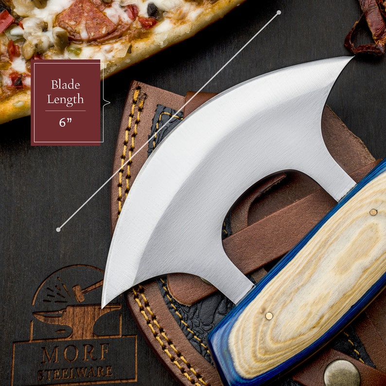 May include: A blue and wood handled knife with a curved blade. The blade is 6 inches long. The knife is in a brown leather sheath.