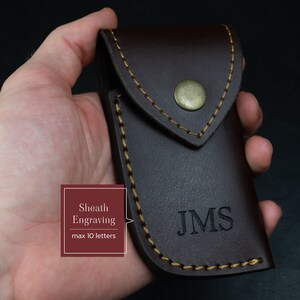 May include: A brown leather sheath with a flap and a gold button. The sheath has a gold stitch around the edges and the initials "JMS" are engraved on the front.  Sheath Engraving max 10 letters.