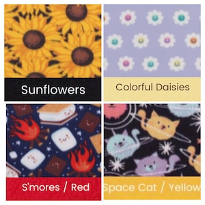 May include: Four fabric swatches with different patterns. Top left: yellow sunflowers. Top right: white daisies with smiling faces on a lavender background. Bottom left: s'mores and campfire on a navy background. Bottom right: space cats on a black background.
