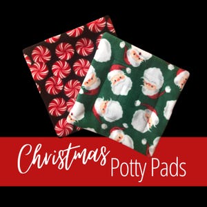 May include: Two Christmas-themed potty pads. One pad features a pattern of red and white peppermint candies on a dark brown background. The other pad has a green background with Santa Claus faces. The text "Christmas Potty Pads" is displayed in white.