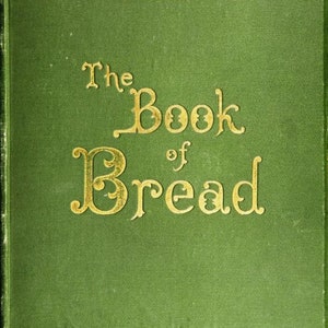 May include: A green book with gold lettering on the cover. The title of the book is "The Book of Bread".