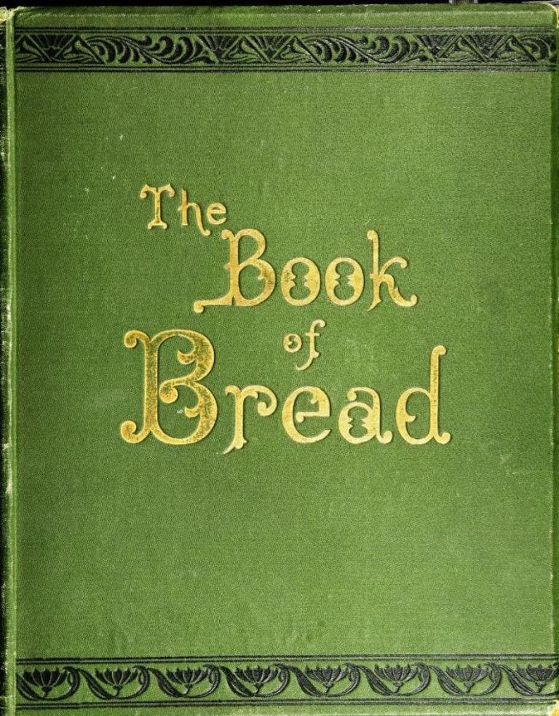 May include: A green book with gold lettering on the cover. The title of the book is "The Book of Bread".