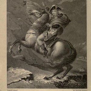 May include: A black and white engraving of Napoleon Bonaparte crossing the Alps on horseback. The image shows Napoleon in military uniform, riding a horse with a determined expression on his face. The engraving is titled "Buonaparte Crossing the Alps."