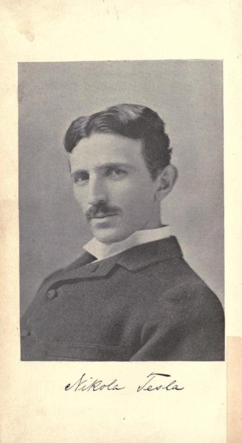 May include: A black and white portrait of Nikola Tesla, a famous inventor and engineer. He is wearing a dark suit and a white collar. His signature is written below the image.