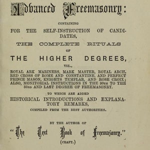 May include: The Text Book of Freemasonry, a vintage book cover with a black and white illustration of a Masonic symbol. The book contains self-instruction for candidates, complete rituals of the higher degrees, and historical introductions and explanatory remarks. Published by Reeves and Turner in London, 1873.