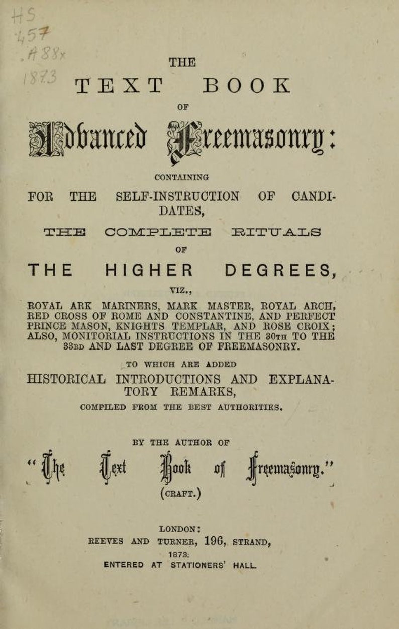 May include: The Text Book of Freemasonry, a vintage book cover with a black and white illustration of a Masonic symbol. The book contains self-instruction for candidates, complete rituals of the higher degrees, and historical introductions and explanatory remarks. Published by Reeves and Turner in London, 1873.