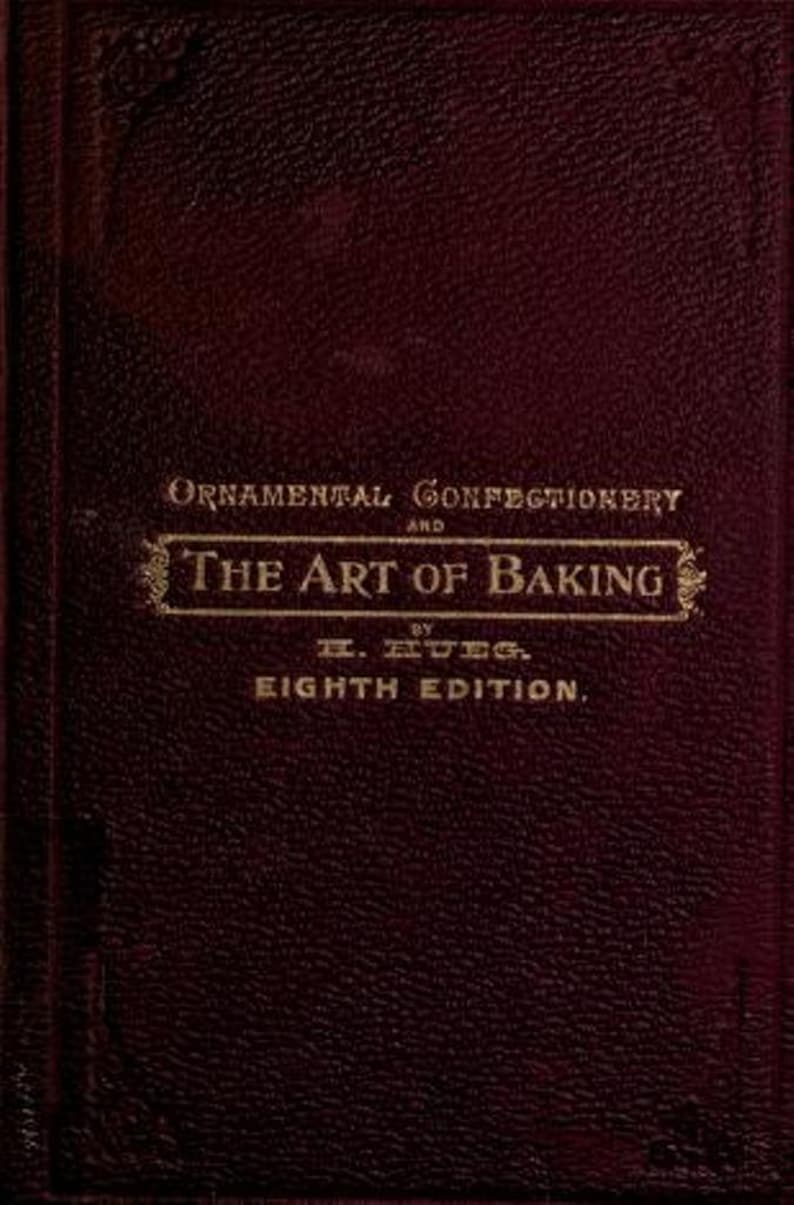 May include: A burgundy book with gold lettering on the cover. The title is "Ornamental Confectionery and The Art of Baking" by E. Ruegg. The book is the eighth edition.