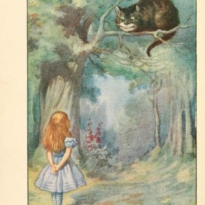 May include: A young girl in a blue and white dress stands in a forest, looking up at a Cheshire Cat sitting in a tree. The cat has a wide grin and is looking down at the girl. The text "I groad when I'm pleased, and wag my tail when I'm angry." is written below the image.
