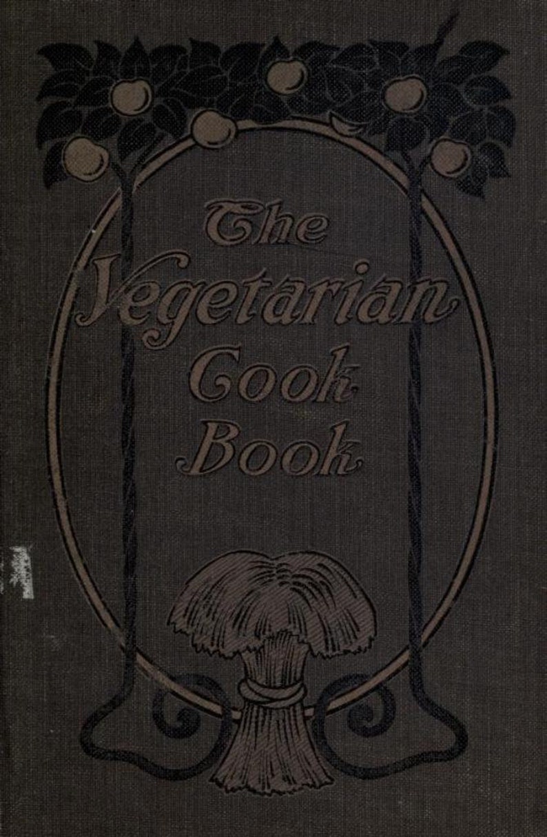 May include: The cover of a vintage cookbook titled "The Vegetarian Cook Book". The cover features a decorative oval frame with a sheaf of wheat at the bottom and two stylized trees with apples at the top.