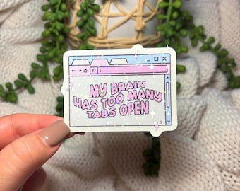 May include: A white sticker with a pink and blue browser window design. The text inside the window reads "My brain has too many tabs open".