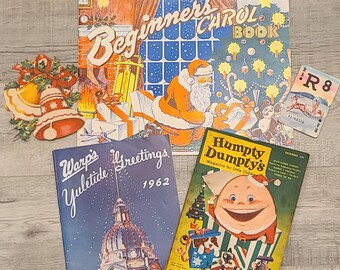 May include: A collection of vintage Christmas and children's books. The books include "Beginner's Carol Book", "Warp's Yuletide Greetings 1962", and "Humpty Dumpty's Magazine for Little Children".