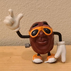 1988 CA Raisin Wind Up Walking Action Figure-Calran-Vintage Toy-Orange Converse-Anthropomorphic-Retro Toy