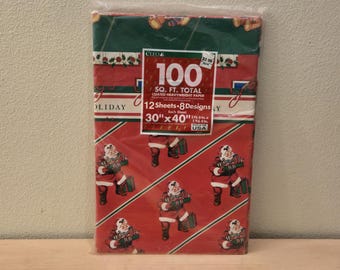 May include: A package of 100 square feet of red and green holiday wrapping paper with a Santa Claus design. The paper is 30 inches by 40 inches and has 8 different designs.