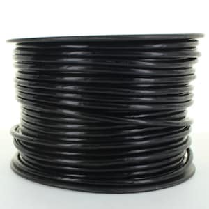 May include: A spool of black electrical wire. The wire is wound tightly around the spool, which is made of black plastic.