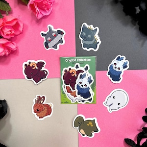 Paquete de pegatinas de 7 piezas de Cryptid Collection: Mothman, Jersey Devil, Jackalope, Nessie, Nightcrawler, Deer Demon(Wendigo), Chupacabra
