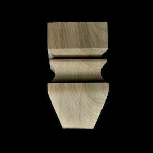 May include: A wooden furniture leg with a turned design. The leg is unfinished and has a natural wood color.