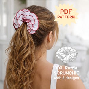 May include: A white pleated fabric hair scrunchie with a red stitched edge and a red and white checkered center. The image includes text that reads PDF PATTERN and XXL Ruffle SCRUNCHIE with 2 designs, along with a line drawing of the scrunchie.
