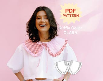May include: A PDF pattern for a Clara ruffle collar, featuring a two-toned red and pink gingham fabric design with a tie closure. The collar is shown worn over a white shirt, with a technical line drawing of the collar included in the image.