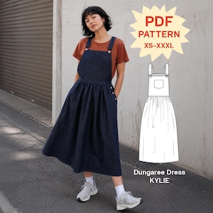May include: A dark blue denim dungaree dress with a front pocket, side buttons, and a gathered skirt. A graphic overlay displays the text PDF PATTERN XS-XXXL and a technical line drawing of the dress labeled Dungaree Dress KYLIE.