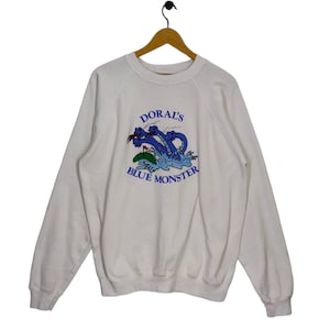 80s Doral&#39;s Blue Monster Raglan Sweatshirt Vintage Hanes Sweater Jumper Pullover Crewneck Golf Resort White Size XL