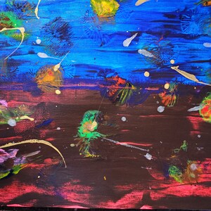 May include: Abstract painting with a dark brown background and a blue sky with white and yellow splatters. The painting has a variety of colors including pink, green, and yellow.