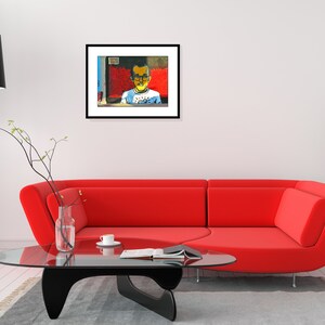 May include: A framed painting of a young person wearing glasses and a blue shirt with a yellow sun graphic. The background is a red, blue, and yellow abstract design.