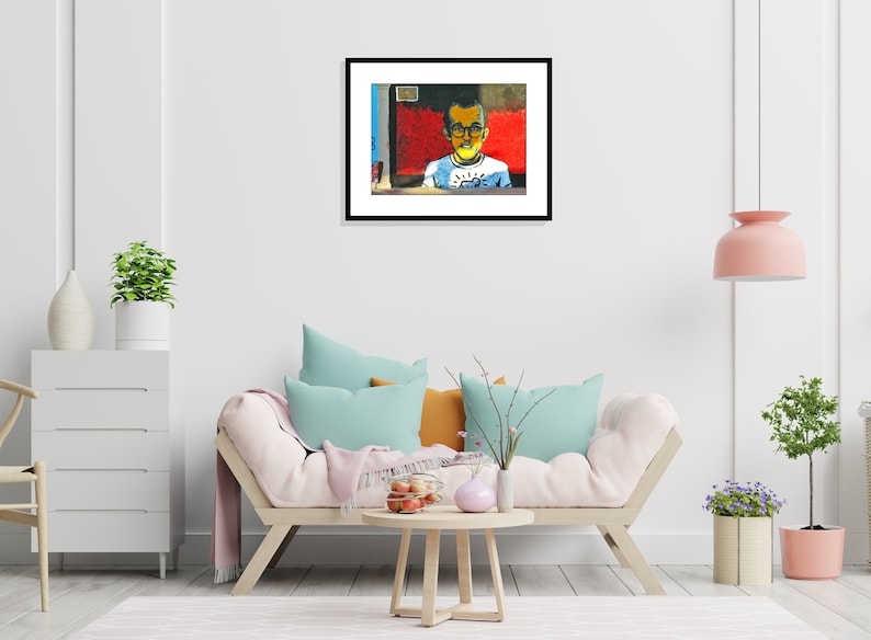 May include: A framed painting of a young person wearing glasses and a white shirt with a blue and yellow design. The background is a red and blue abstract design.