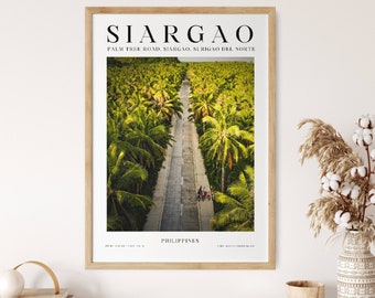 May include: A framed print with a photo of a road lined with palm trees in Siargao, Philippines. The text "SIARGAO" is at the top of the print, and "PALM TREE ROAD, SIARGAO, SURIGAO DEL NORTE" is below it. The text "PHILIPPINES" is at the bottom of the print.