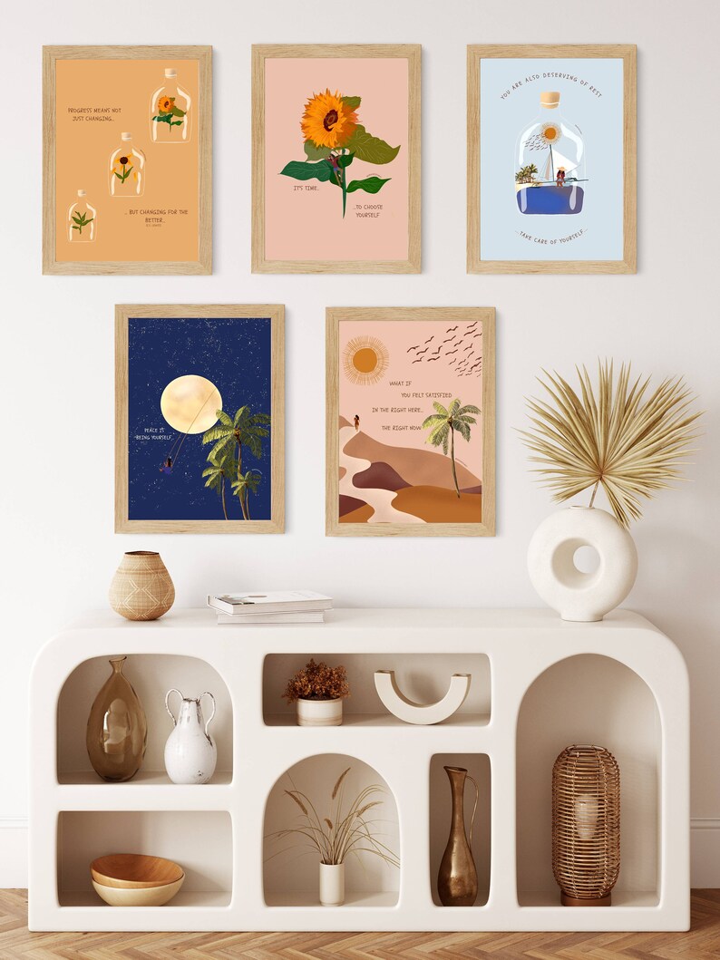 May include: A set of six minimalist wall art prints with inspirational quotes and nature-inspired imagery. The prints feature a variety of colours, including blue, green, yellow, and brown. The prints are framed in natural wood frames.