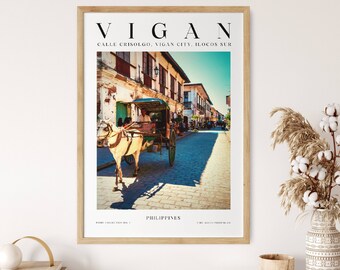 May include: A vintage travel poster featuring a horse-drawn carriage on a cobblestone street in Vigan, Philippines. The poster has a white background with black text that reads "Vigan, Calle Crisologo, Vigan City, Ilocos Sur, Philippines".