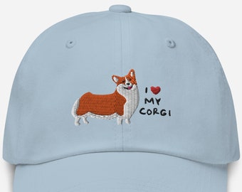 May include: A light blue baseball cap with an embroidered image of a corgi dog and the text "I love my corgi!"