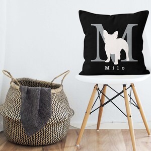 May include: Black and white throw pillow with a white silhouette of a French bulldog inside a gray letter M. The pillow has the name "Milo" printed in white below the letter.