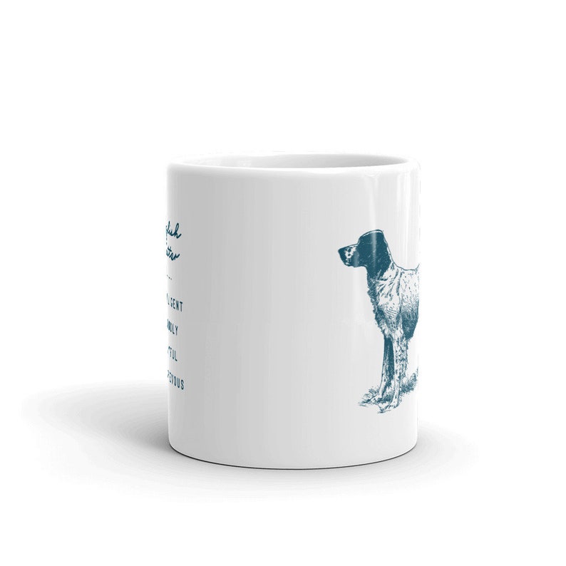 May include: White ceramic mug with a blue illustration of a dog on the right side. The text "English Setter" is on the left side of the mug.